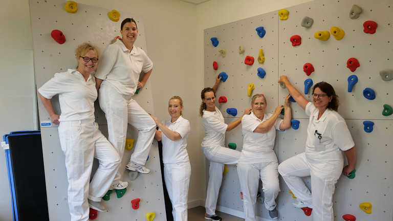 Geriatrie-Team an Kletterwand Geriatrie-Team an Kletterwand